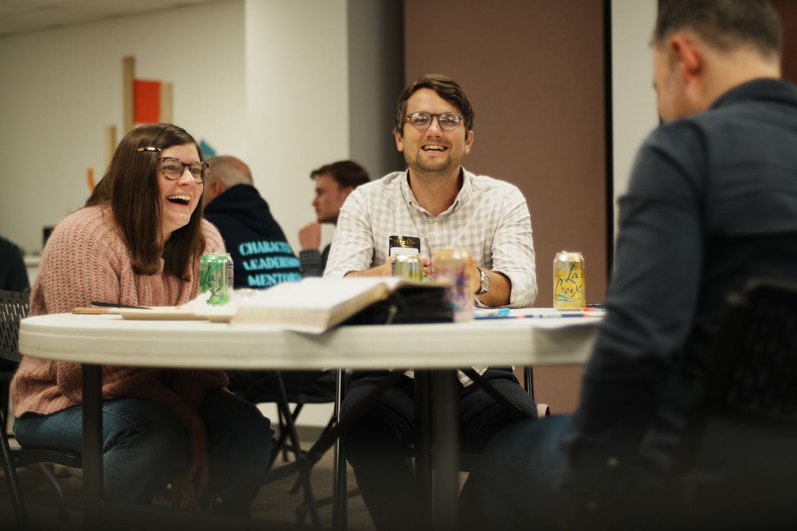Pastors and planters laughing together around a table